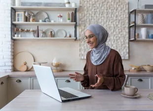 young-beautiful-muslim-woman-in-hijab-using-laptop-2022-09-28-23-19-44-utc